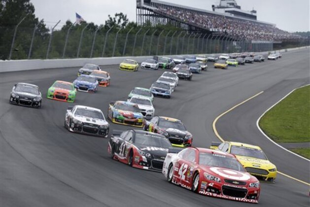 Kyle Larson (42) leads a pack of cars at the start of the NASCAR Sprint Cup Series auto race at Pocono Raceway, Sunday, Aug. 3, 2014, Long Pond, Pa. (AP Photo/Mel Evans)