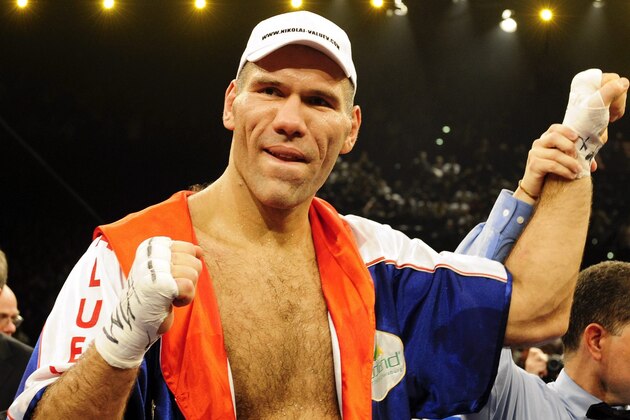 Russian WBA heavyweight champion Nikolai Valuev celebrates after winning his WBA heavyweight boxing world championships fight against Evander Holyfield of the United States, at the Hallenstadion venue in Zurich, Switzerland , Saturday, Dec. 20, 2008. Valuev ended any hope of Evander Holyfield winning a fifth heavyweight title, narrowly defending his WBA title by majority decision . (AP Photo/Keystone, Walter Bieri)