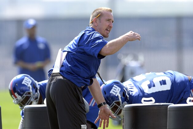 New York Giants defensive coordinator Steve Spagnuolo gives instructions during practice at the team's NFL football rookie minicamp Friday, May 8, 2015, in East Rutherford, N.J.  (AP Photo/Bill Kostroun)