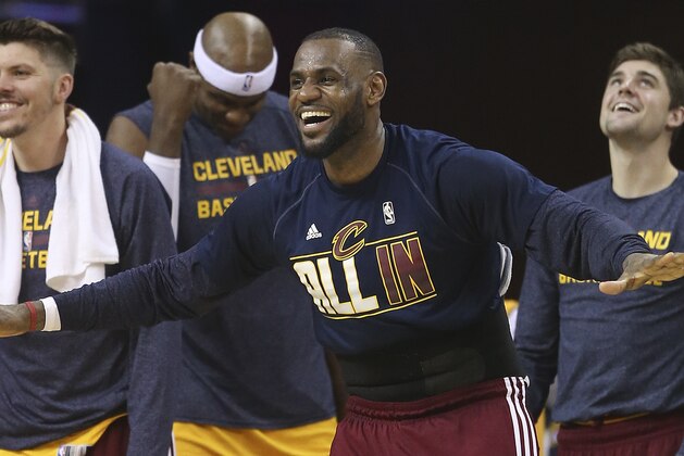 Cleveland Cavaliers forward LeBron James reacts on the sidelines late in the second half of Game 4 of the NBA basketball Eastern Conference Finals against the Atlanta Hawks, Tuesday, May 26, 2015, in Cleveland. (AP Photo/Ron Schwane)