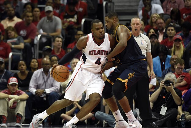 May 20, 2015; Atlanta, GA, USA; Atlanta Hawks forward Paul Millsap (4) drives against Cleveland Cavaliers center Tristan Thompson (13) during the second quarter of game one of the Eastern Conference Finals of the NBA Playoffs at Philips Arena. Mandatory Credit: Dale Zanine-USA TODAY Sports