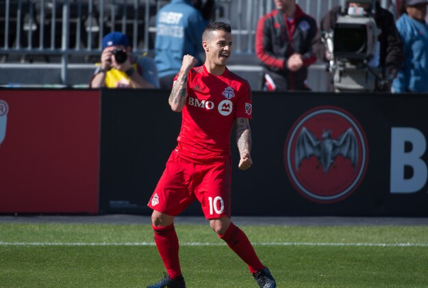 May 23, 2015; Toronto, Ontario, CAN; Toronto FC midfielder Sebastian Giovinco (10) celebrates scoring a goal during the first half in a game against the Portland Timbers at BMO Field. Toronto FC won 1-0. Mandatory Credit: Nick Turchiaro-USA TODAY Sports