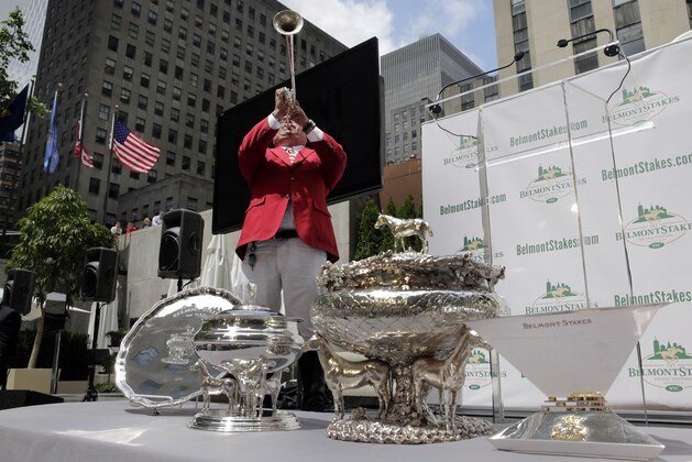 Belmont Park bugler Sam Grossman blows the call to the post before the post position draw for the 147th Belmont Stakes at New York's Rockefeller Center, Wednesday, June 3, 2015. American Pharoah was made the early 3-5 favorite on Wednesday to win the Belmont Stakes and become U.S. horse racing's first Triple Crown winner in 37 years. (AP Photo/Richard Drew)