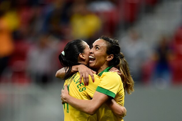 BRASILIA, BRAZIL - DECEMBER 10:  Marta (R) and Andressa of Brazil celebrate the victory against Argentina during a match between Brazil and Argentina as part of International Women's Football Tournament of Brasilia at Mane Garrincha Stadium on December 10, 2014 in Brasilia, Brazil.  (Photo by Buda Mendes/Getty Images)