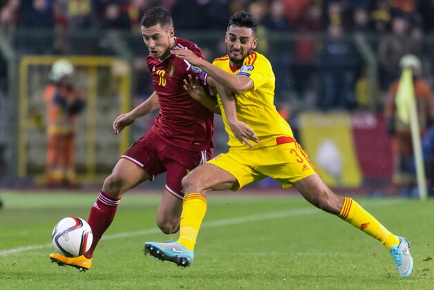 Belgium's Eden Hazard, left, challenges Wales' Neil Taylor during their Euro 2016 qualifying match in group B at the King Baudouin stadium in Brussels, Sunday, Nov. 16, 2014. (AP Photo/Geert Vanden Wijngaert)