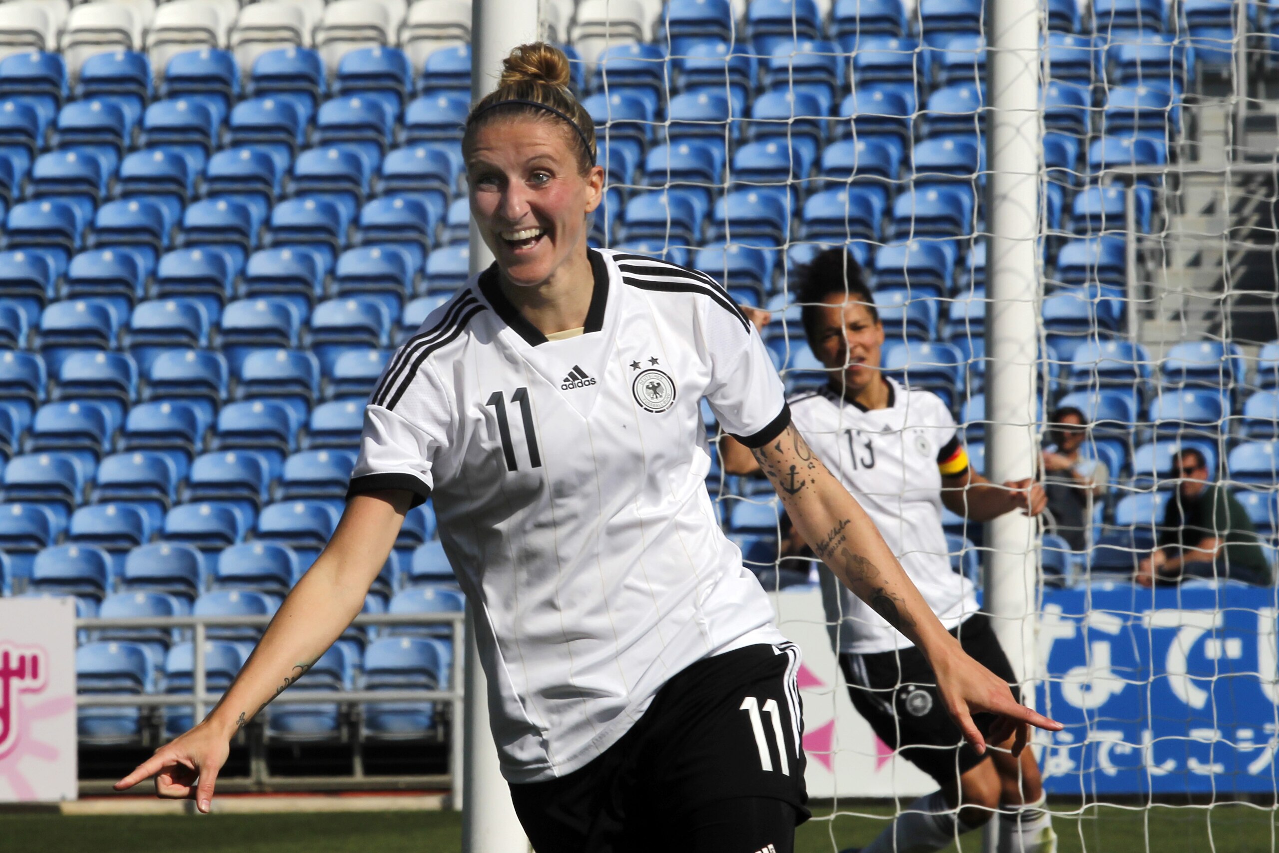 Germany's Anja Mittag celebrates after scoring her side's second goal during the women's soccer Algarve Cup final match between Germany and Japan at the Algarve stadium, outside Faro, southern Portugal, Wednesday, March 12, 2014. Mittag scored once in Germany's 3-0 victory. (AP Photo/Francisco Seco)