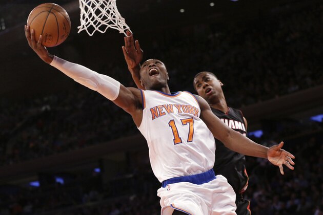 New York Knicks' Cleanthony Early (17) goes up past Miami Heat center Hassan Whiteside on a shot during the second half of an NBA basketball game, Friday, Feb. 20, 2015, at Madison Square Garden in New York. The Heat won 111-87. (AP Photo/Mary Altaffer)