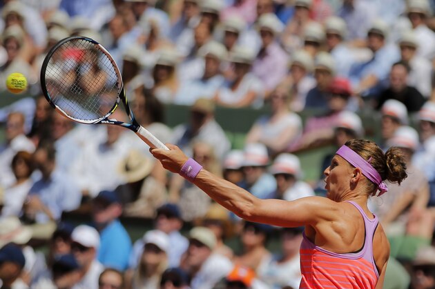 Lucie Safarova of the Czech Republic returns in the semifinal match of the French Open tennis tournament against Serbia's Ana Ivanovic at the Roland Garros stadium, in Paris, France, Thursday, June 4, 2015. (AP Photo/Christophe Ena)
