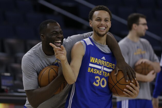 Golden State Warriors' Draymond Green, left, and Stephen Curry laugh during an NBA basketball practice, Wednesday, June 3, 2015, in Oakland, Calif. The Warriors host the Cleveland Cavaliers in Game 1 of the NBA Finals on Thursday. (AP Photo/Ben Margot)