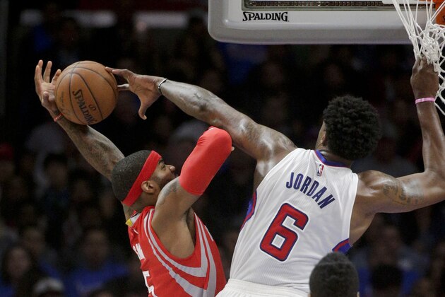 Los Angeles Clippers center DeAndre Jordan, right, fouls Houston Rockets forward Josh Smith during the first half of Game 6 in a second-round NBA basketball playoff series in Los Angeles, Thursday, May 14, 2015. (AP Photo/Jae C. Hong)