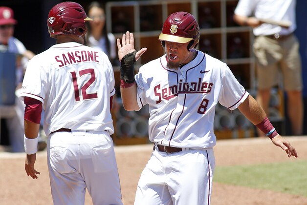 Florida State's DJ Stewart (8) celebrates with teammate John Sansone (12) after they both scored runs in the bottom of the seventh inning against Louisville in an NCAA college ACC baseball tournament game Saturday, May 23, 2015, in Durham, N.C. Florida State won 6-0 to advance to the finals Sunday. (AP Photo/Karl B DeBlaker) Florida State's DJ Stewart (8) celebrates with teammate John Sansone (12) after they both scored runs in the bottom of the seventh inning against Louisville in an NCAA college ACC baseball tournament game Saturday, May 23, 2015, in Durham, N.C. Florida State won 6-0 to advance to the finals Sunday. (AP Photo/Karl B DeBlaker)