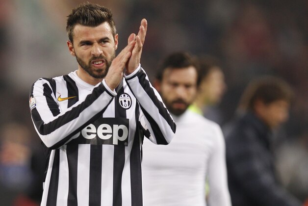 Juventus' Andrea Barzagli salutes supporters during an Italian Cup, round of eight, soccer match, between AS Roma and Juventus at Rome's Olympic stadium, Tuesday, Jan. 21, 2014. (AP Photo/Alessandra Tarantino)