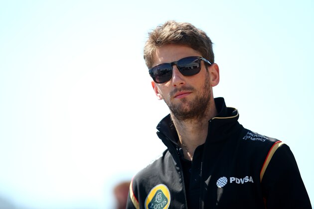 MONTREAL, QC - JUNE 04:  Romain Grosjean of France and Lotus walks across the paddock during previews to the Canadian Formula One Grand Prix at Circuit Gilles Villeneuve on June 4, 2015 in Montreal, Canada.  (Photo by Mark Thompson/Getty Images)