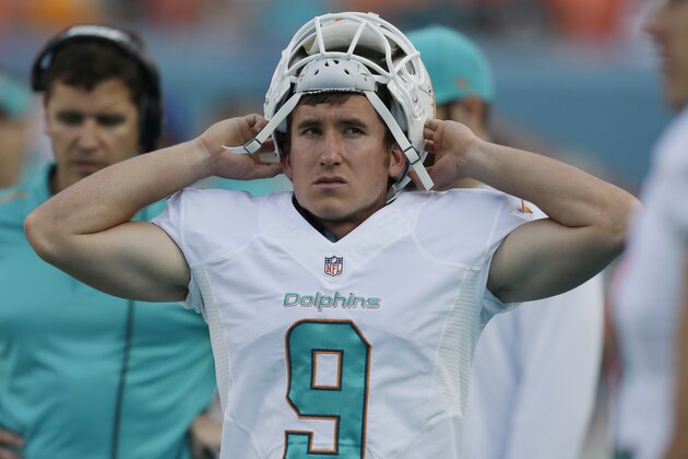 Miami Dolphins kicker Caleb Sturgis (9) walks along the sideline during the second half of an NFL football game against the Baltimore Ravens, Sunday, Dec. 7, 2014 in Miami Gardens, Fla. The Ravens defeated the Dolphins 28-13. (AP Photo/Wilfredo Lee)