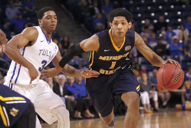 Murray State's Cameron Payne drives around Tulsa's Shaquille Harrison during the second half of an NCAA college basketball game in the National Invitation Tournament, Monday, March 23, 2015, in Tulsa, Okla. Murray State beat Tulsa 83-62. (AP Photo/Dave Crenshaw)