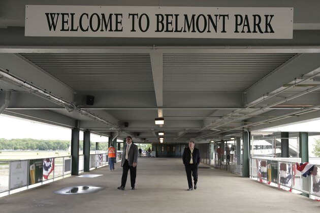 Men walk along the adjoining bridge from Belmont Park to the Long Island Railroad after a ceremony opening the newly renovated facility, Thursday, June 4, 2015, in Elmont, N.Y. Metropolitan Transportation Authority and New York Racing Association officials unveiled a newly refurbished Belmont Park train station ahead of Saturday's running of the Belmont Stakes. (AP Photo/Julie Jacobson) Men walk along the adjoining bridge from Belmont Park to the Long Island Railroad after a ceremony opening the newly renovated facility, Thursday, June 4, 2015, in Elmont, N.Y. Metropolitan Transportation Authority and New York Racing Association officials unveiled a newly refurbished Belmont Park train station ahead of Saturday's running of the Belmont Stakes. (AP Photo/Julie Jacobson)