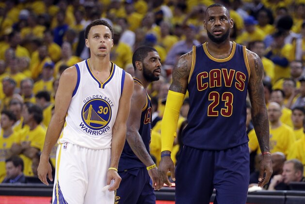 Golden State Warriors guard Stephen Curry (30) and Cleveland Cavaliers forward LeBron James (23) walk on the floor during the second half of Game 1 of basketball's NBA Finals in Oakland, Calif., Thursday, June 4, 2015. (AP Photo/Ben Margot)