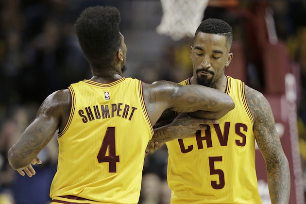 Cleveland Cavaliers'  Iman Shumpert (4) congratulates teammate J.R. Smith (5) after Smith made a 3-point basket during the second quarter of an NBA basketball game against the Brooklyn Nets, Wednesday, March 18, 2015, in Cleveland. The Cavaliers defeated the Nets 117-92. (AP Photo/Tony Dejak)