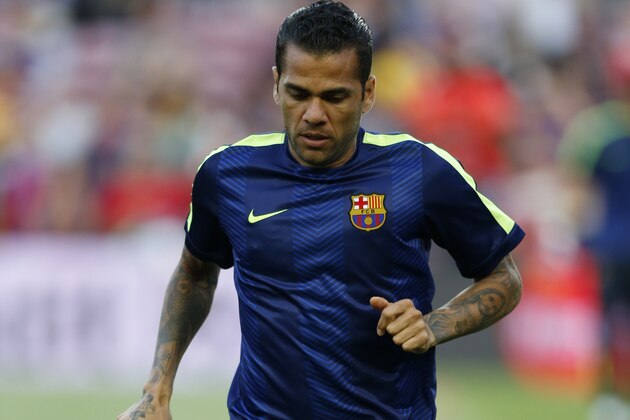 Barcelona's Dani Alves warms up for the Champions League semifinal first leg soccer match between Barcelona and Bayern Munich at the Camp Nou stadium in Barcelona, Spain, Wednesday, May 6, 2015.  (AP Photo/Manu Fernandez)