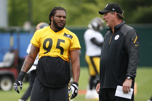Pittsburgh Steelers linebacker Jarvis Jones (95) talks with defensive coordinator Keith Butler, right, during an NFL football organized team activity, in Pittsburgh, Tuesday, June 2, 2015. (AP Photo/Gene J. Puskar)
