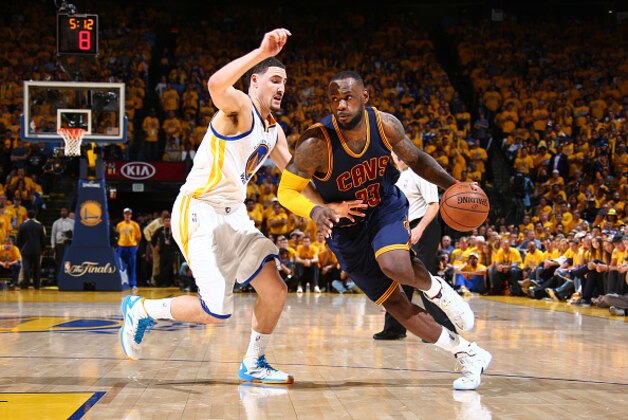 OAKLAND, CA - JUNE 4: LeBron James #23 of the Cleveland Cavaliers drives against Klay Thompson #11 of the Golden State Warriors during Game One of the 2015 NBA Finals on June 4, 2015 at Oracle Arena in Oakland, California. NOTE TO USER: User expressly acknowledges and agrees that, by downloading and or using this photograph, user is consenting to the terms and conditions of Getty Images License Agreement. Mandatory Copyright Notice: Copyright 2015 NBAE (Photo by Nathaniel S. Butler/NBAE via Getty Images)