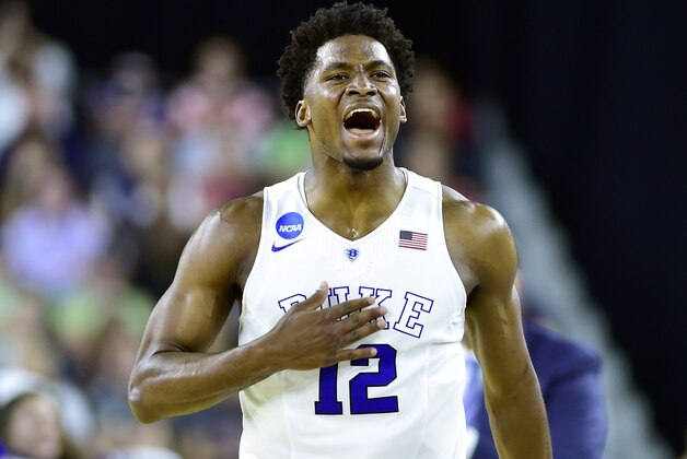 Mar 27, 2015; Houston, TX, USA; Duke Blue Devils forward Justise Winslow (12) reacts after making a three-point basket against the Utah Utes during the second half in the semifinals of the south regional of the 2015 NCAA Tournament at NRG Stadium. Mandatory Credit: Bob Donnan-USA TODAY Sports