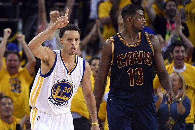 Jun 4, 2015; Oakland, CA, USA; Golden State Warriors guard Stephen Curry (30) reacts in front of Cleveland Cavaliers center Tristan Thompson (13) after making a basket during the second quarter in game one of the NBA Finals at Oracle Arena. Mandatory Credit: Kyle Terada-USA TODAY Sports