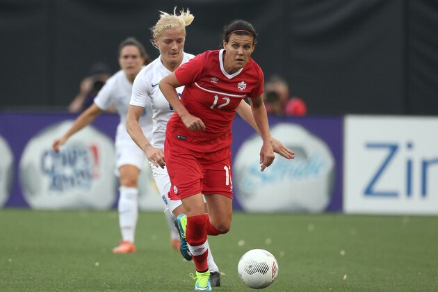HAMILTON, CANADA - MAY 29: Christine Sinclair #12 of Canada runs with the ball against England during their Women's International Friendly match on May 29, 2015 at Tim Hortons Field in Hamilton, Ontario, Canada. (Photo by Tom Szczerbowski/Getty Images)