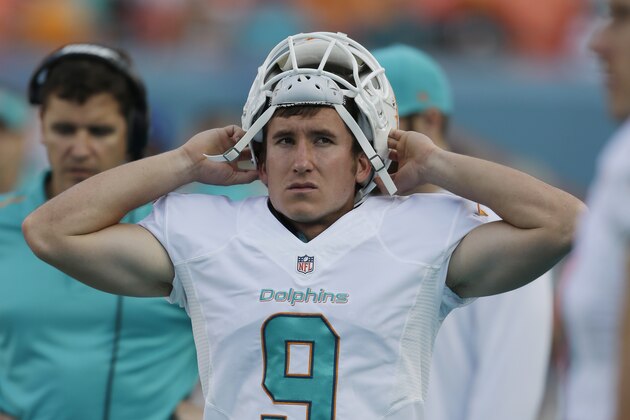 Miami Dolphins kicker Caleb Sturgis (9) walks along the sideline during the second half of an NFL football game against the Baltimore Ravens, Sunday, Dec. 7, 2014 in Miami Gardens, Fla. The Ravens defeated the Dolphins 28-13. (AP Photo/Wilfredo Lee)