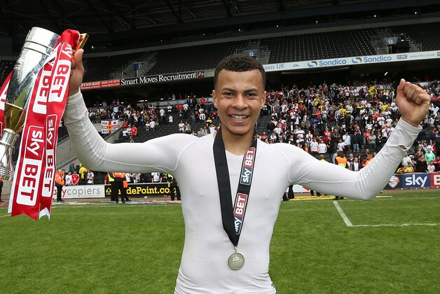 MILTON KEYNES, ENGLAND - MAY 03:  Dele Alli of MK Dons celebrates after gaining promotion to the Championship at the end of the Sky Bet League One match between MK Dons and Yeovil Town at Stadium mk on May 3, 2015 in Milton Keynes, England.  (Photo by Pete Norton/Getty Images)