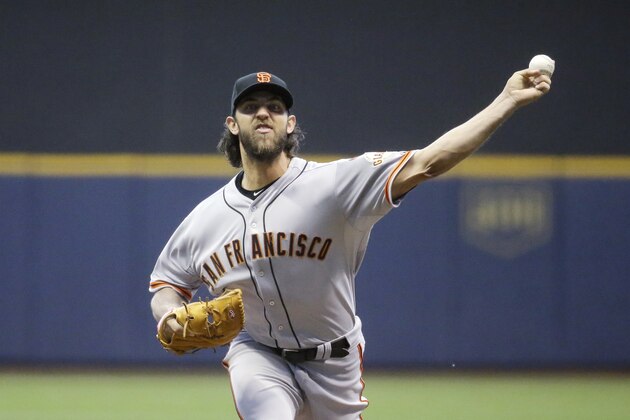 San Francisco Giants starting pitcher Madison Bumgarner throws during the first inning of a baseball game against the Milwaukee Brewers Tuesday, May 26, 2015, in Milwaukee. (AP Photo/Morry Gash)