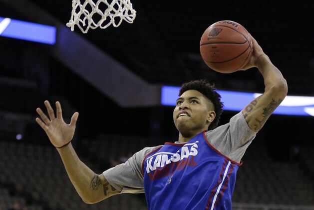 Kansas guard Kelly Oubre Jr. drives to the basket during practice for an NCAA college basketball tournament second round game, Thursday, March 19, 2015, in Omaha, Neb. Kansas plays New Mexico State on Friday. (AP Photo/Charlie Neibergall)