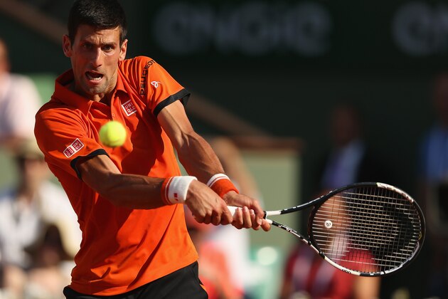 PARIS, FRANCE - JUNE 05:  Novak Djokovic of Serbia plays a backhand in his Men's Semi Final match against Andy Murray of Great Britain on day thirteen of the 2015 French Open at Roland Garros on June 5, 2015 in Paris, France.  (Photo by Clive Brunskill/Getty Images)