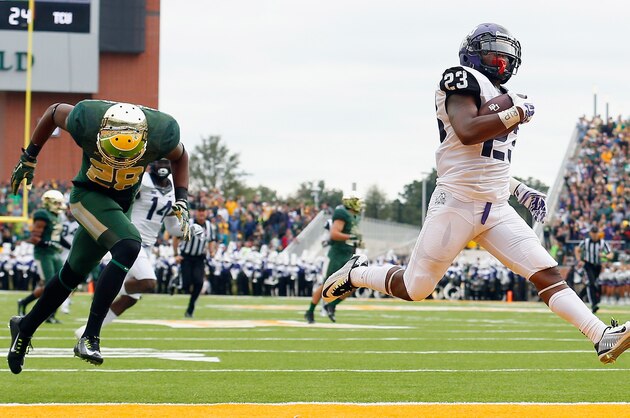 WACO, TX - OCTOBER 11:  B.J. Catalon #23 of the TCU Horned Frogs returns a kickoff for a touchdown against Orion Stewart #28 of the Baylor Bears in the first half at McLane Stadium on October 11, 2014 in Waco, Texas.  (Photo by Tom Pennington/Getty Images)