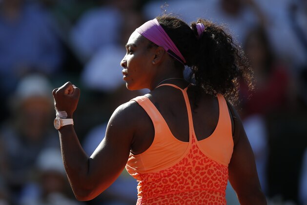 Serena Williams of the U.S. clenches her fist after scoring a point in her semifinal match of the French Open tennis tournament against Timea Bacsinszky of Switzerland at the Roland Garros stadium, in Paris, France, Thursday, June 4, 2015. (AP Photo/Francois Mori)