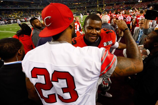 ARLINGTON, TX - JANUARY 12:  LeBron James of the Cleveland Cavaliers congratulates quarterback Cardale Jones #12 of the Ohio State Buckeyes after defeating the Oregon Ducks 42 to 20 in the College Football Playoff National Championship Game at AT&T Stadium on January 12, 2015 in Arlington, Texas.  (Photo by Kevin C. Cox/Getty Images)