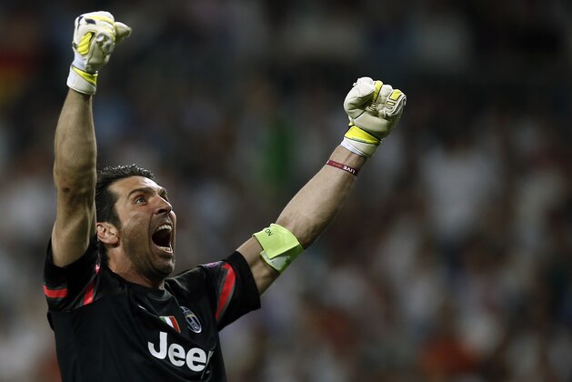 Juventus goalkeeper Gianluigi Buffon celebrates after his teammate Alvaro Morata scored during the Champions League second leg semifinal soccer match between Real Madrid and Juventus, at the Santiago Bernabeu stadium in Madrid, Wednesday, May 13, 2015. (AP Photo/Andres Kudacki)