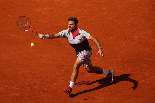 PARIS, FRANCE - JUNE 05:  Stanislas Wawrinka of Switzerland returns a shot in his Men's Semi Final against Jo-Wilfried Tsonga of France on day thirteen of the 2015 French Open at Roland Garros on June 5, 2015 in Paris, France.  (Photo by Clive Brunskill/Getty Images)