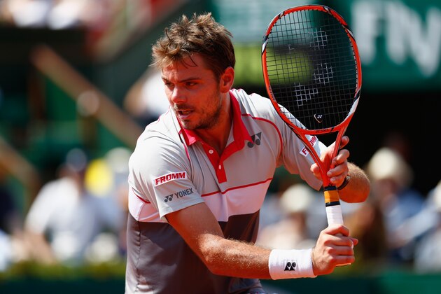 PARIS, FRANCE - JUNE 05:  Stanislas Wawrinka of Switzerland returns a shot in his Men's Semi Final against Jo-Wilfried Tsonga of France on day thirteen of the 2015 French Open at Roland Garros on June 5, 2015 in Paris, France.  (Photo by Julian Finney/Getty Images)