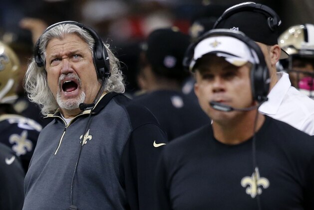 New Orleans Saints defensive coordinator Rob Ryan, left, yells behind head coach Sean Payton, right, in the second half of an NFL football game in New Orleans, Sunday, Dec. 21, 2014. (AP Photo/Bill Haber)