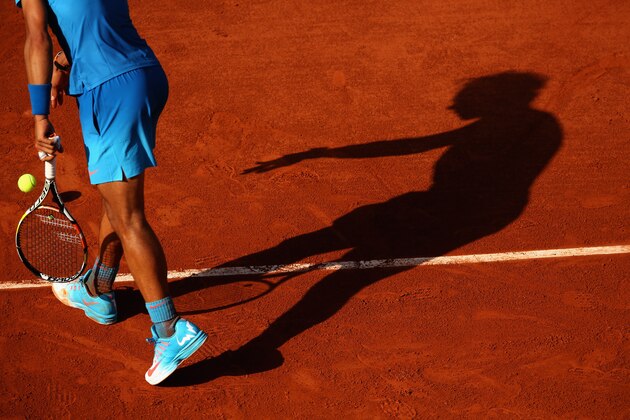 PARIS, FRANCE - JUNE 03:  Rafael Nadal of Spain serves in his Men's quarter final match against Novak Djokovic of Serbia on day eleven of the 2015 French Open at Roland Garros on June 3, 2015 in Paris, France.  (Photo by Clive Brunskill/Getty Images)