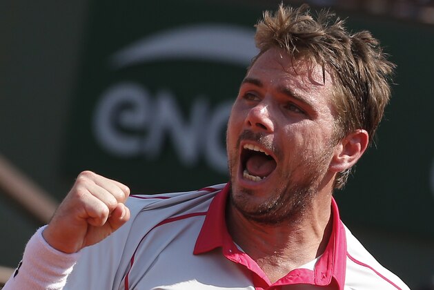 Switzerland's Stan Wawrinka clenches his fist after scoring a point in the semifinal match of the French Open tennis tournament against France's Jo-Wilfried Tsonga at the Roland Garros stadium, in Paris, France, Friday, June 5, 2015. (AP Photo/Michel Euler)