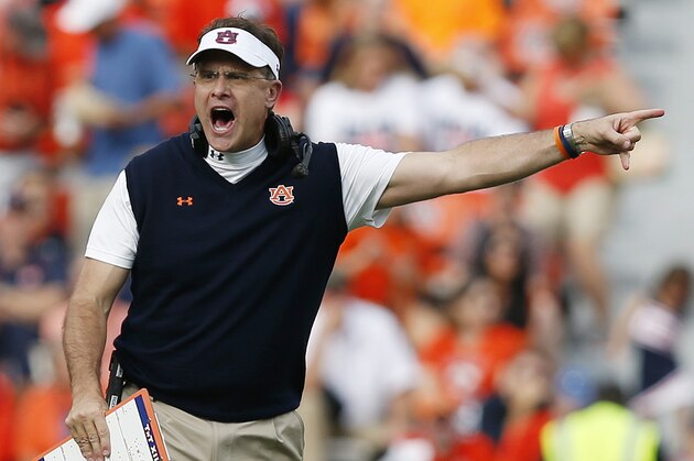 Auburn head coach Gus Malzahn gestures to the referees on a play he didn't agree with during the first half of an NCAA college football game against Louisiana Tech on Saturday, Sept. 27, 2014, in Auburn, Ala. (AP Photo/Brynn Anderson)