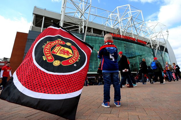 MANCHESTER, ENGLAND - APRIL 04:  Fans arrive at the stadium for the Barclays Premier League match between Manchester United and Aston Villa at Old Trafford on April 4, 2015 in Manchester, England.  (Photo by Jan Kruger/Getty Images)