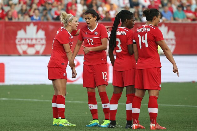 HAMILTON, CANADA - MAY 29: Christine Sinclair #12 of Canada checks with the goalkeeper before forming a wall against England during their Women's International Friendly match on May 29, 2015 at Tim Hortons Field in Hamilton, Ontario, Canada. (Photo by Tom Szczerbowski/Getty Images)