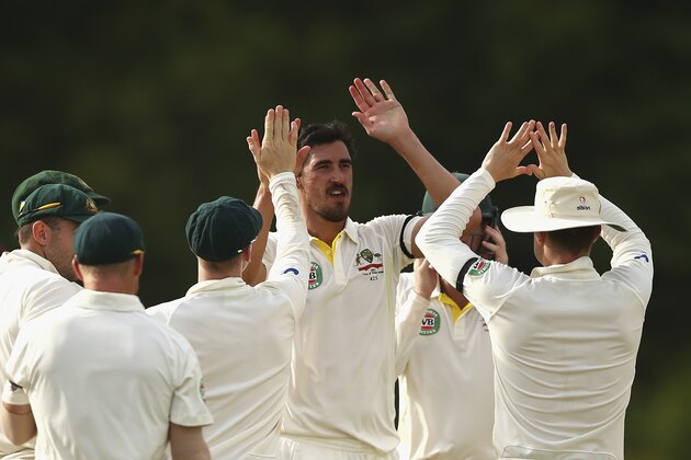 ROSEAU, DOMINICA - JUNE 05:  Mitchell Starc of Australia celebrates after taking the wicket of Devendra Bishoo of West Indies during day three of the First Test match between Australia and the West Indies at Windsor Park on June 5, 2015 in Roseau, Dominica.  (Photo by Ryan Pierse/Getty Images)