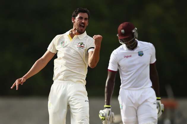 ROSEAU, DOMINICA - JUNE 05:  Mitchell Starc of Australia celebrates after taking the wicket of Devendra Bishoo of West Indies during day three of the First Test match between Australia and the West Indies at Windsor Park on June 5, 2015 in Roseau, Dominica.  (Photo by Ryan Pierse/Getty Images)