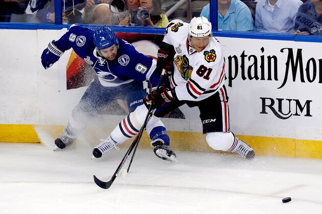 TAMPA, FL - JUNE 03: Tyler Johnson #9 of the Tampa Bay Lightning and Marian Hossa #81 of the Chicago Blackhawks battle for the puck in the second period during Game One of the 2015 NHL Stanley Cup Final at Amalie Arena on June 3, 2015 in Tampa, Florida. (Photo by Mike Carlson/Getty Images) TAMPA, FL - JUNE 03: Tyler Johnson #9 of the Tampa Bay Lightning and Marian Hossa #81 of the Chicago Blackhawks battle for the puck in the second period during Game One of the 2015 NHL Stanley Cup Final at Amalie Arena on June 3, 2015 in Tampa, Florida. (Photo by Mike Carlson/Getty Images)