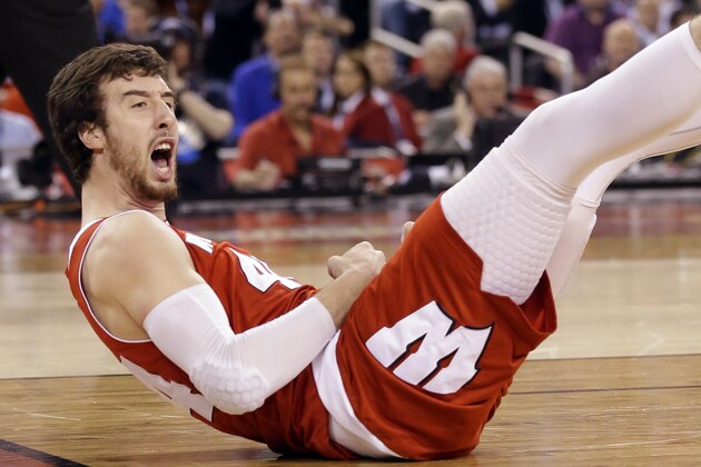 Wisconsin's Frank Kaminsky (44) reacts as he falls during the first half of the NCAA Final Four college basketball tournament championship game against Duke Monday, April 6, 2015, in Indianapolis. (AP Photo/Michael Conroy)