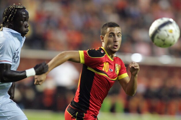Belgium's Eden Hazard, right, fights for the ball with France's Bacary Sagna during a friendly soccer match at the King Baudouin stadium in Brussels, Wednesday, Aug. 14, 2013. (AP Photo/Francois Walschaerts)